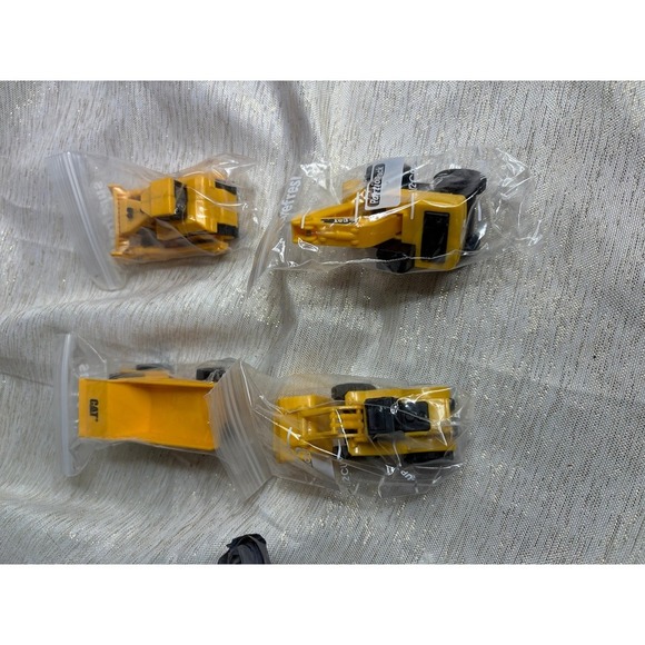 four miniature CAT construction vehicle toys - Picture 1 of 3
